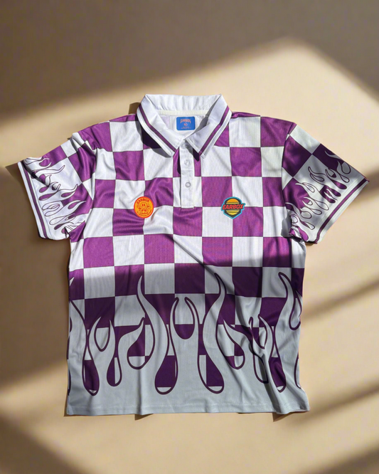 Checkered shirt with purple flames and logo on a wooden surface