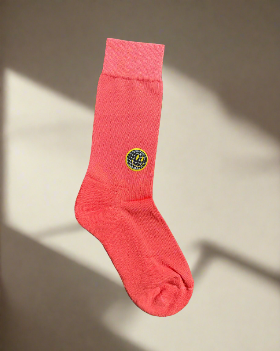 Red sock with a logo on a beige background